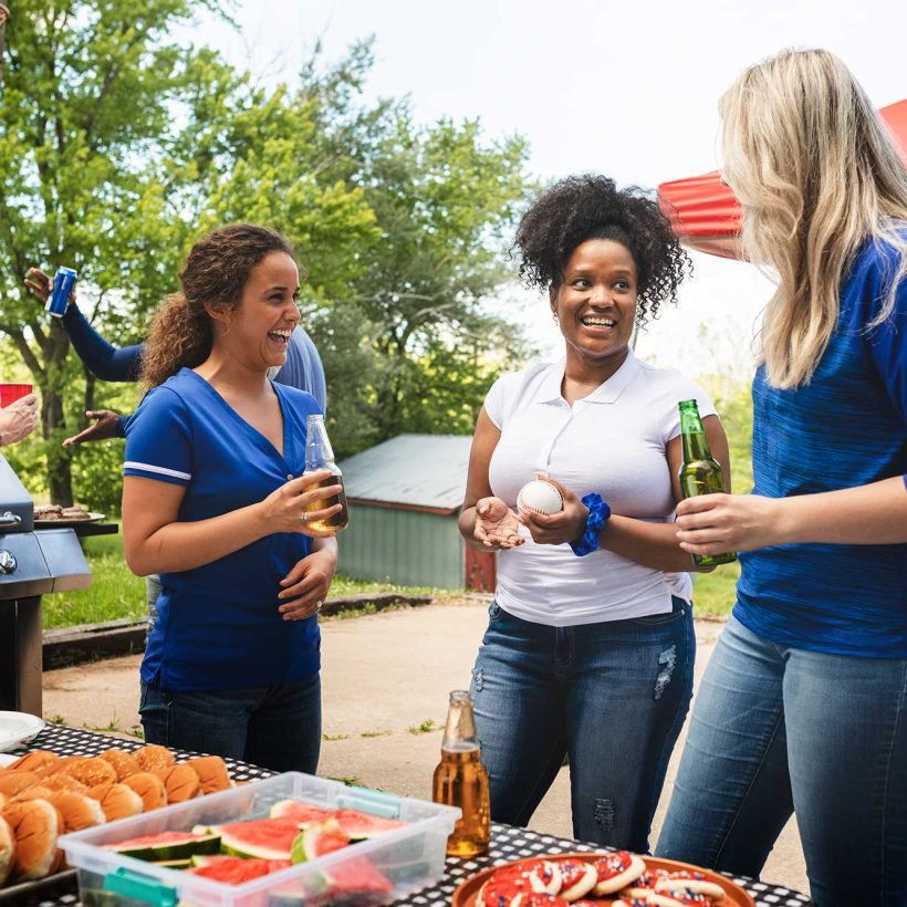 friends-celebrating-and-eating-at-a-tailgate-party-2022-12-16-00-27-20-utc.jpg